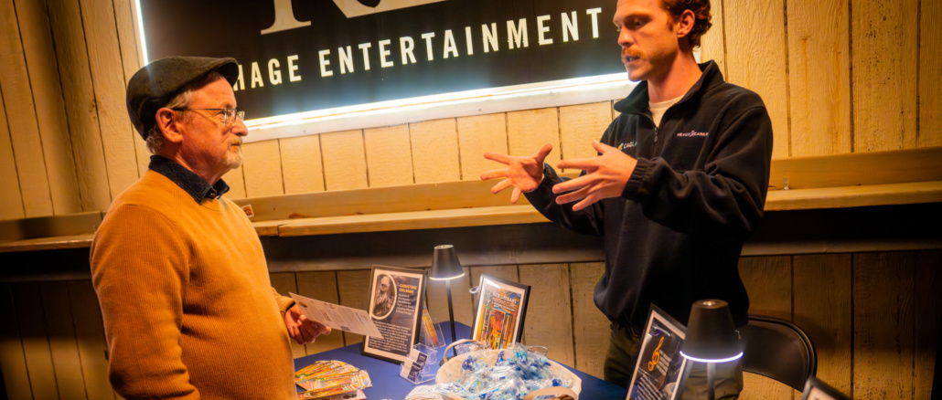 NOMAF - Chickie Wah Wah -39.jpg NOMAF staff member, Jacob Maza, explains our mission & initiatives to a patron at a Fundraiser at Chickie-Wah-Wah Photo Credit: Hunter Miles Davis